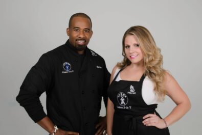 man and woman in chef's aprons