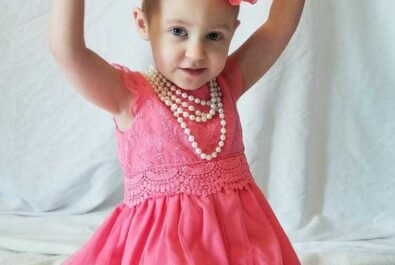 girl in a tutu with a flower on her head