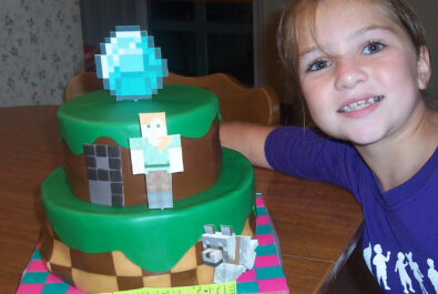 girl with a minecraft cake