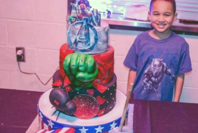 boy with an avengers cake