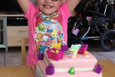 girl with a custom basket cake