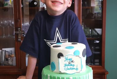 boy with a custom cake