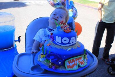 boy with a finding nemo cake