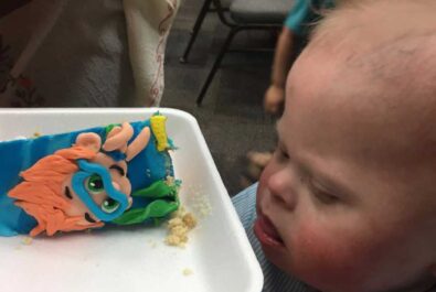 boy with a slice of cake