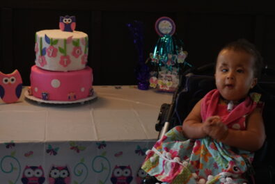 girl at a birthday table