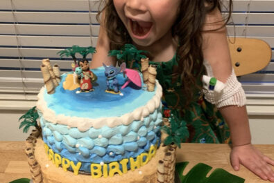 girl with a lilo and stitch cake